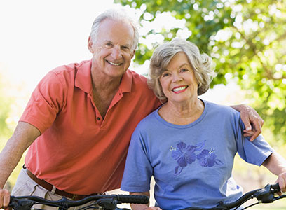 Photo of a man and woman on bicycles. Link to Life Stage Gift Planner Ages 60-70 Situations.